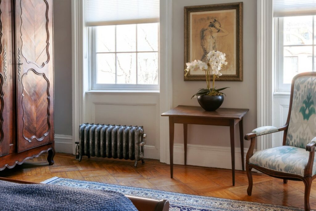 Ornate Rococo 3 Column cast iron radiator in West village Manhattan New York.