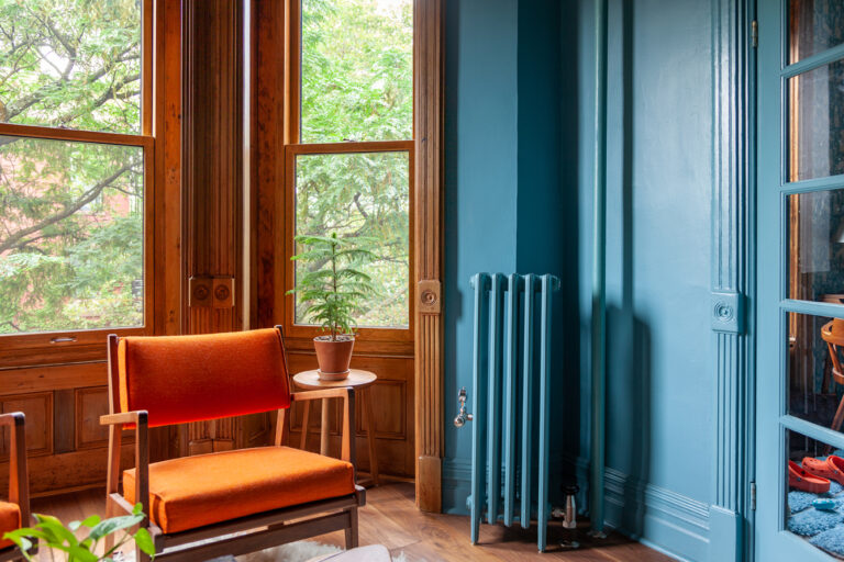 Castrads Mercury 6 Column 960mm cast iron radiator in Brooklyn Brownstone apartment finished in Farrow and Ball stone blue.