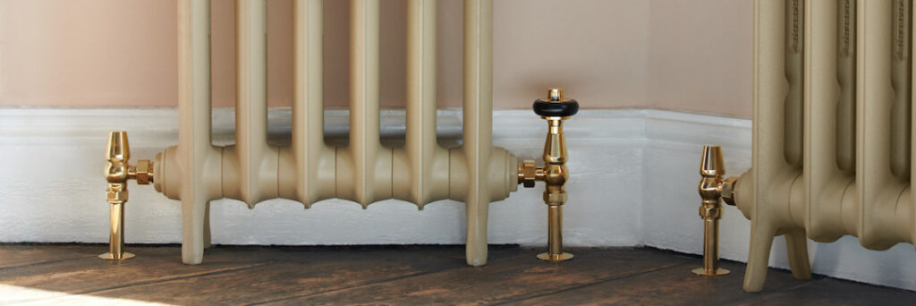 unlaquered brass radiator wall stay on cast iron school style radiator