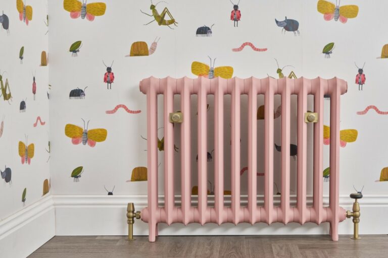 Lifestyle photo of the Emmeline cast iron radiator by Castrads painted in Little Greene's 'Blush'.