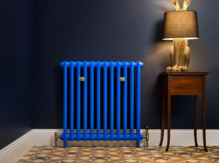 Lifestyle photo of the Emmeline I 35in Cast iron radiator custom made by Castrads in Benjamin Moore's Evening Blue.