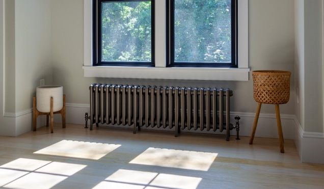 Lifestyle image of Grace 4 Column 20in cast iron radiator in New Jersey lakeside house.