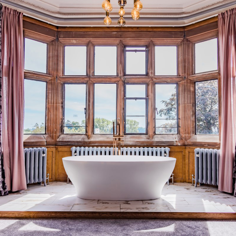 Ornate cast iron radiator in bathroom