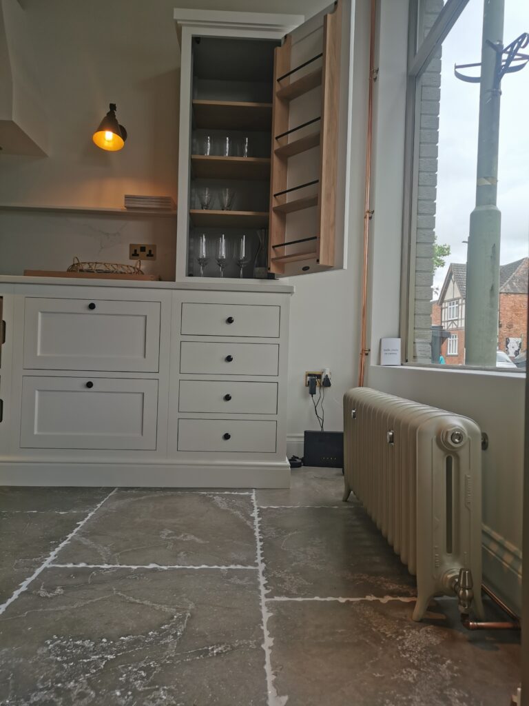 Emmeline cast iron radiator in Neptune Kitchens showroom Market Harborough