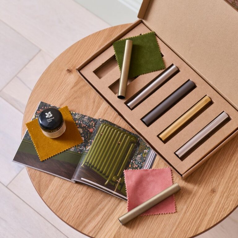 Brassware samples for cast iron radiator valves and pipe shrouds with Little Greene paint tester pot