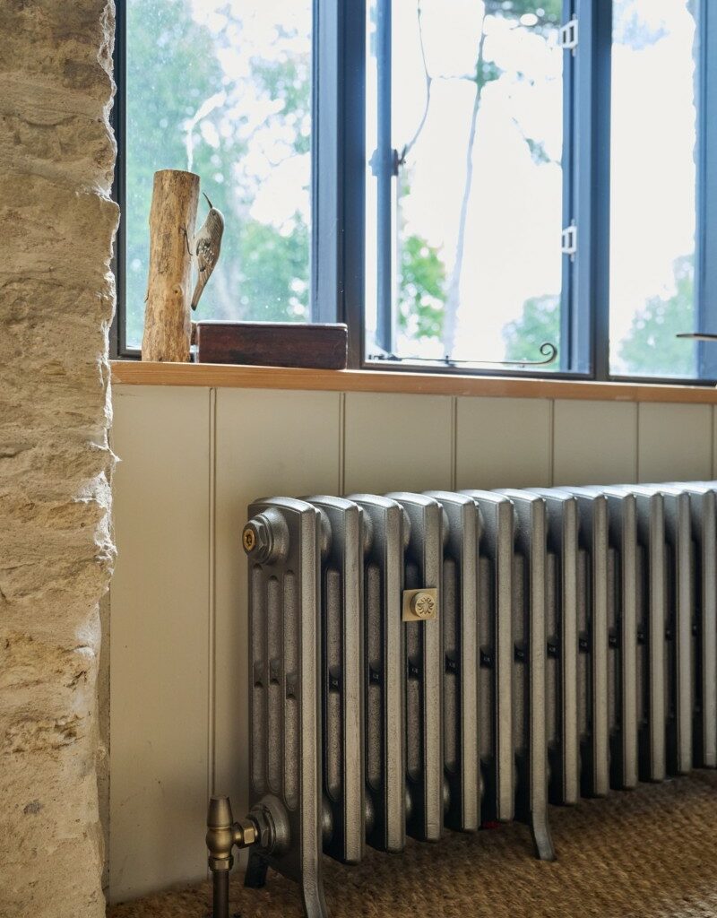 Castrads cast iron radiator in Somerset Mill conversion running a water source heat pump