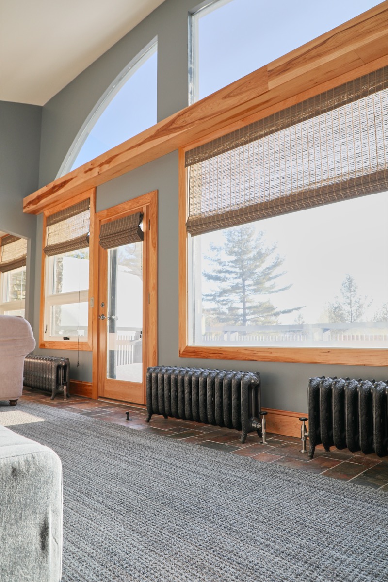 Detail of polished cast iron radiator surface at Hillside Farmhouse, Vermont